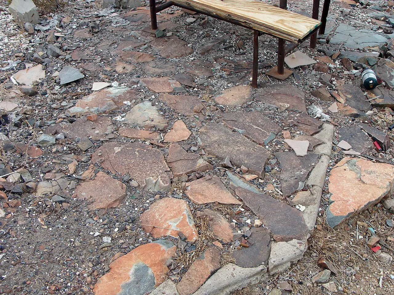 Stone patio built around a simple outdoor seating area